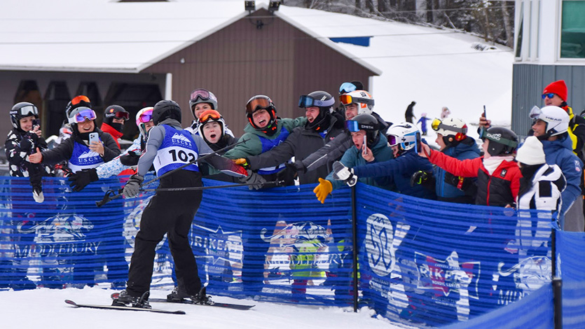 Marist University Image: Griffin Barrows ’26 high-fives his teammates after his final ski race. Photo by Laura Lynch. 