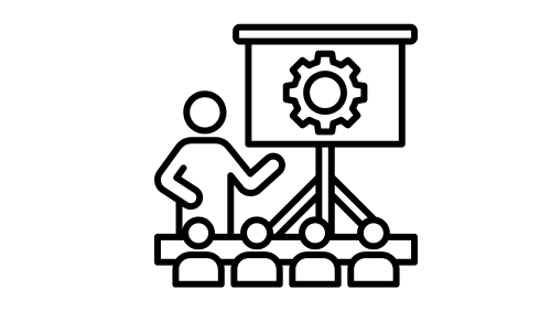 Icon of a person presenting to an audience, pointing to a screen with a gear symbol. Represents technical training or a workshop setting. Simple line art.